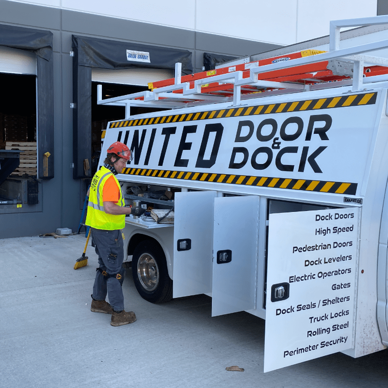 United Door & Dock Truck and Employee in front of Dock Seal