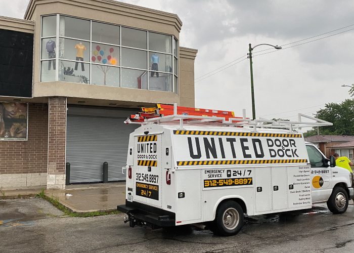 United Door and Dock Truck Parked Outside of Project Location with Roll Up Door