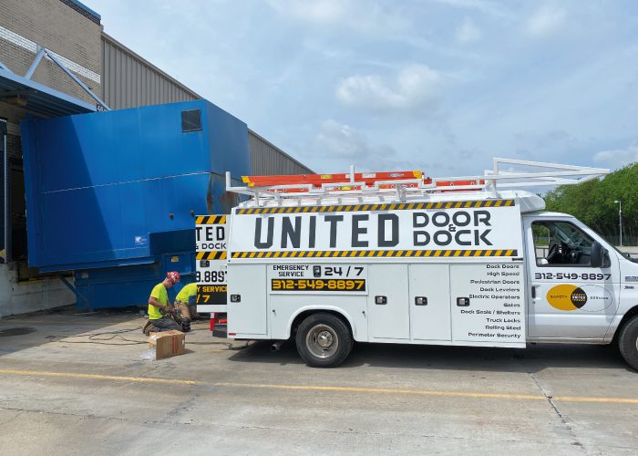 United Door and Dock Truck Parked Outside Warehouse Docks