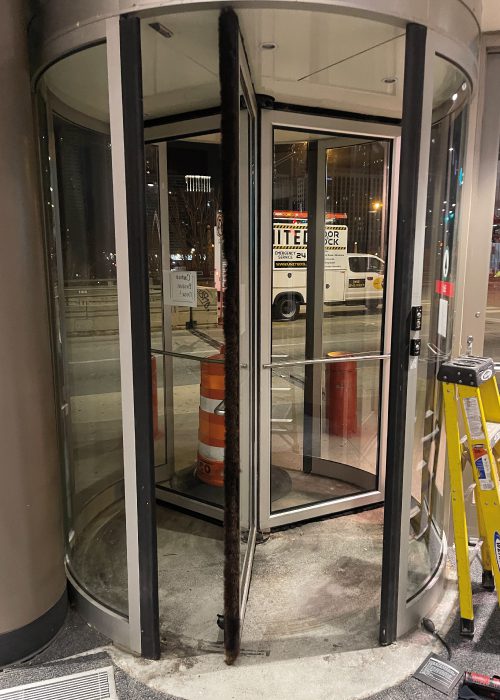 Revolving Glass Door with United Door and Dock Truck Parked Outside of Target