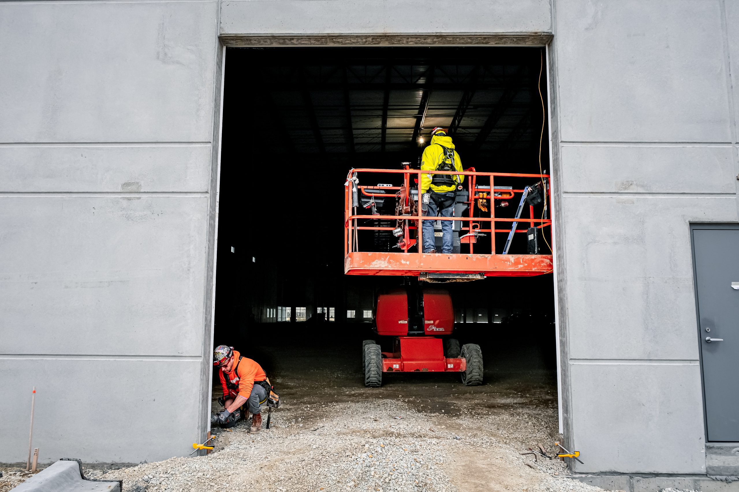 United Door and Dock Technicians Installing Large Sectional Door